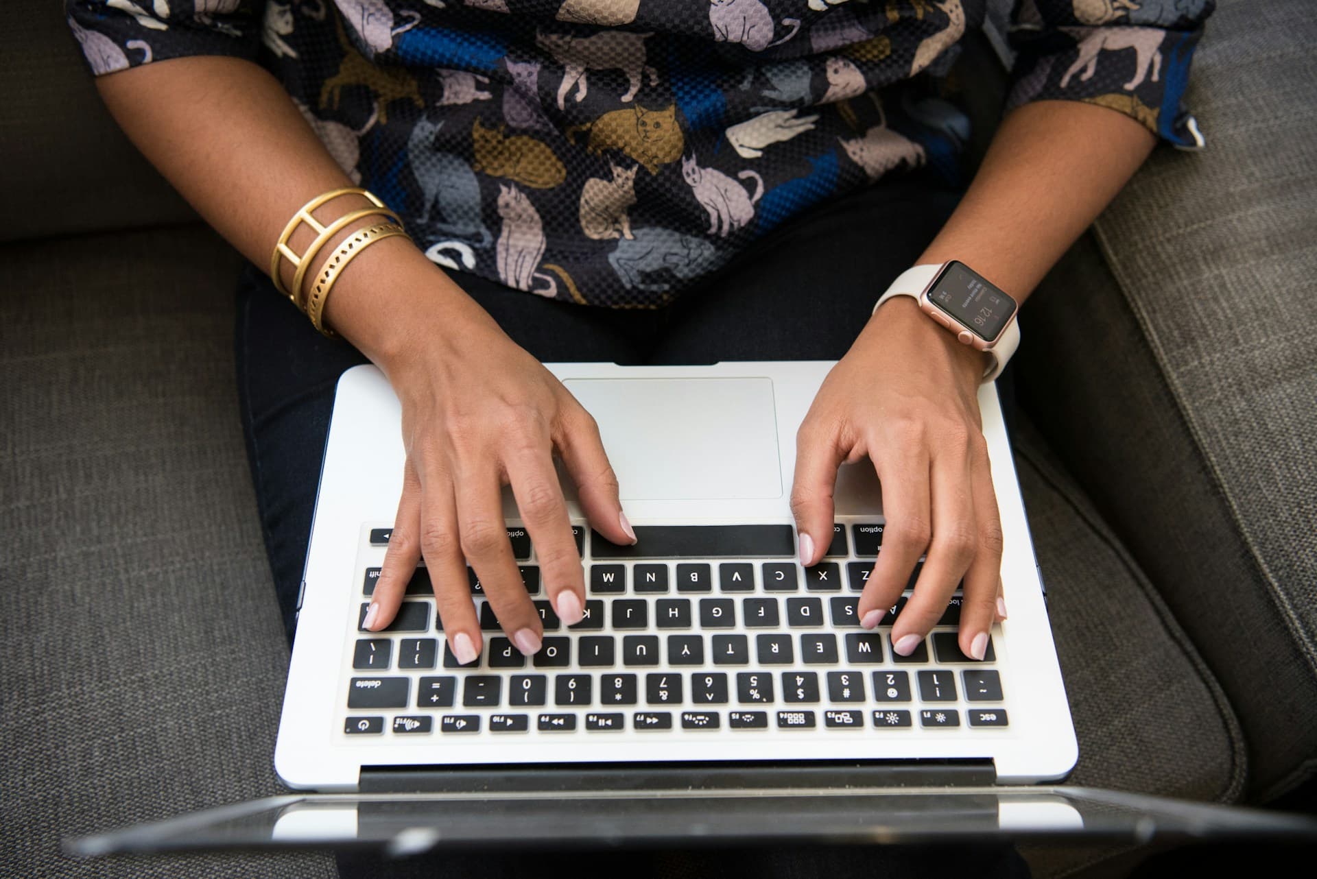 team member typing on laptop